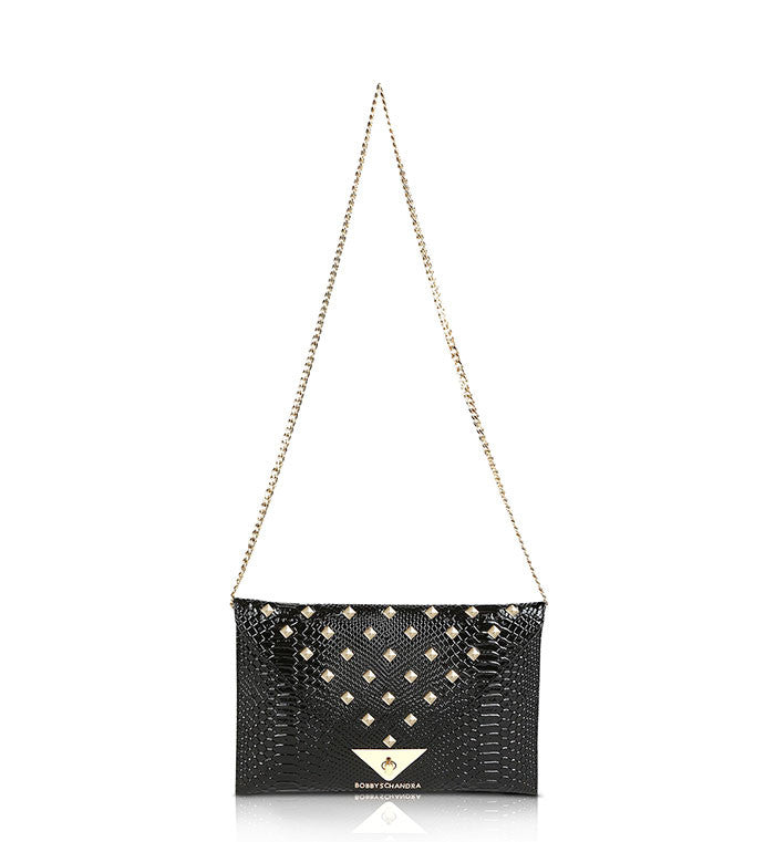 Black and gold leather studded clutch purse bag Schandra